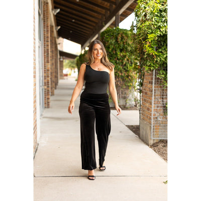 Women’s flowy velvet wide leg holiday pants. Velvet wide leg trousers styled for holiday outfits