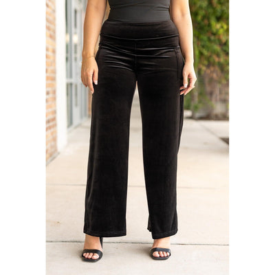 Women’s flowy velvet wide leg holiday pants. Velvet wide leg trousers styled for holiday outfits